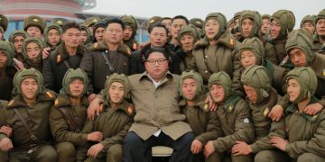 North Korean leader Kim Jong Un poses with sharpshooters of the Air and Anti-Aircraft Force in North Korea