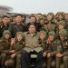 North Korean leader Kim Jong Un poses with sharpshooters of the Air and Anti-Aircraft Force in North Korea